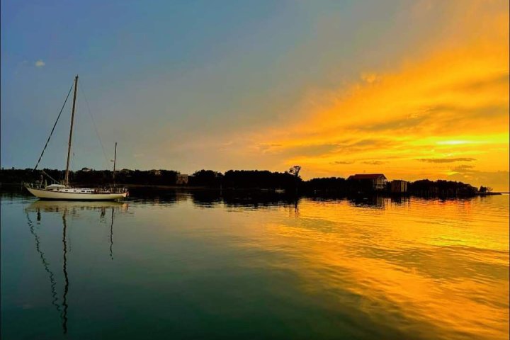 a sunset over a body of water