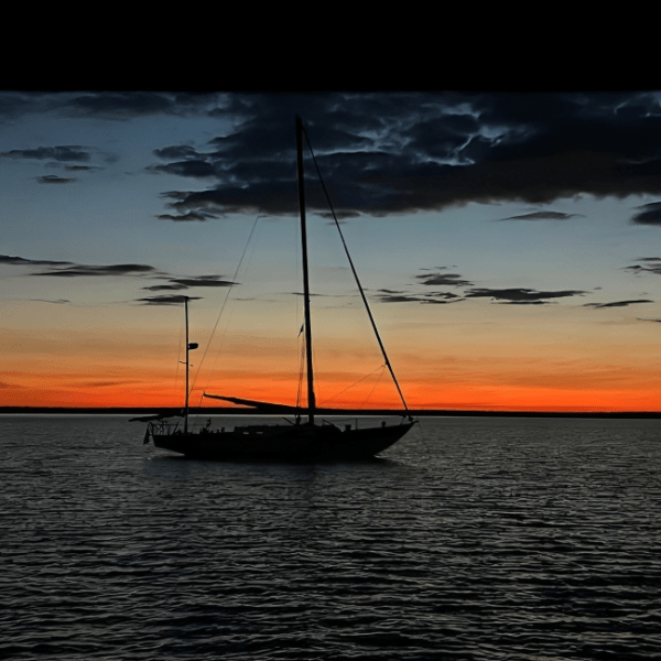 a small boat in a large body of water