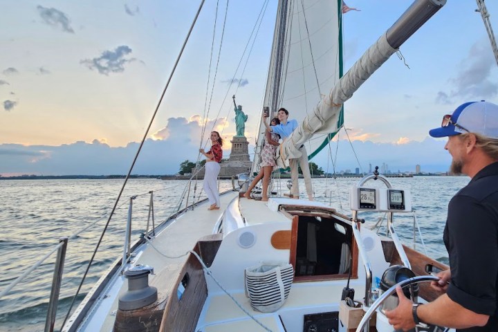 a group of people in a boat on a body of water