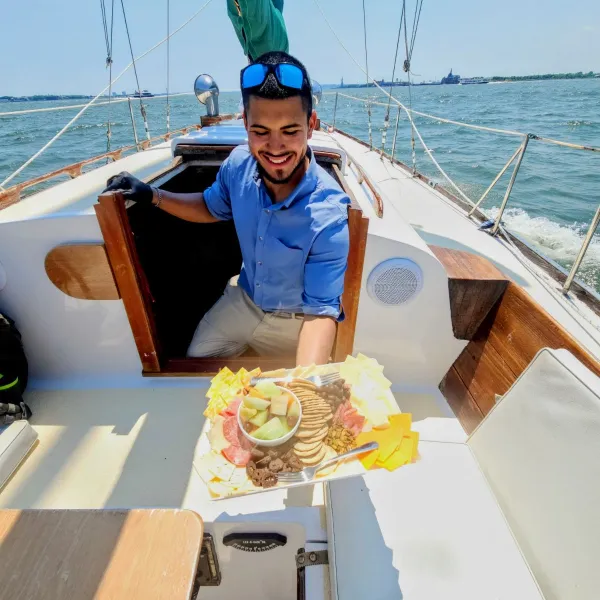 a person sitting in a boat on a body of water