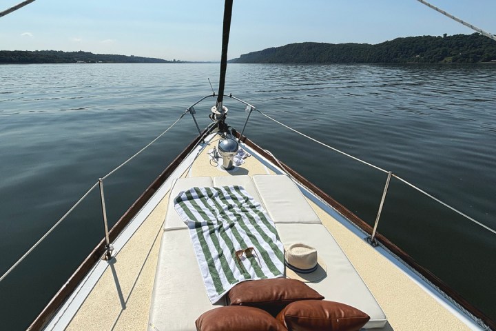 a boat that is sitting on a dock next to a body of water