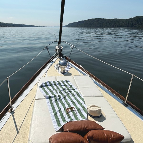 a boat that is sitting on a dock next to a body of water