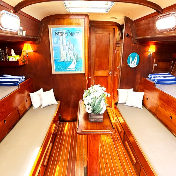 a wooden table next to a fireplace