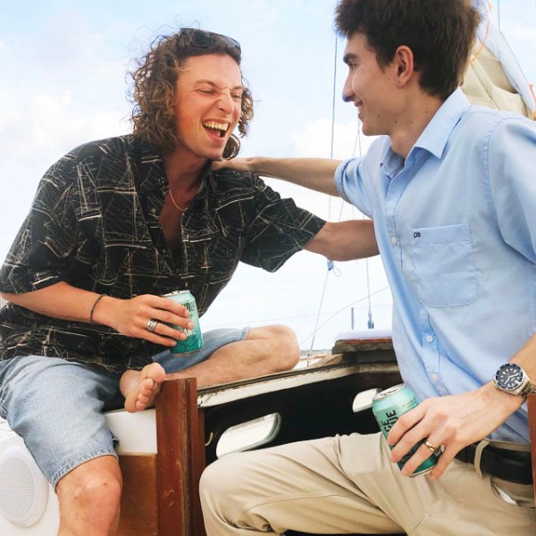 a man and a woman sitting on a table