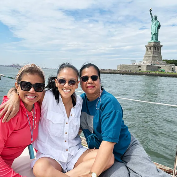 Joice Mujuru et al. that are sitting on a boat in the water