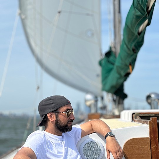 a man riding on the back of a boat